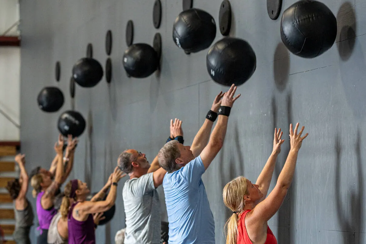 A class throwing wall balls together